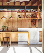 Custom-made kitchen made of wood and Carrara marble