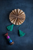 Hand-made paper rosette with tassels