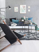 Living room with grey-painted walls and blue-green accessories