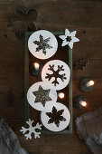 Star and snowflake pendants and lit candles
