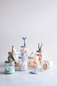 Storage jars with recycled toys decorating lids