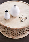 Round coffee table with vases and glasses