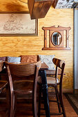 Rustic dining room with wood paneling