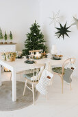 Christmas tree in festively decorated dining area