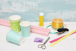 Materials for making Easter baskets from paper cups and craft paper