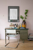 Cantilever chair and old desk against pink wall