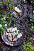 Fish and vegetable terrine scattered with herbs