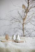 Vintage-style bells and Christmas trees on slices of tree trunk