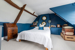 Attic bedroom with blue walls