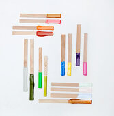 Wooden sticks with paint samples on ends