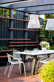 Modern garden furniture on the covered terrace in gray