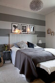 Wall decorated with wide horizontal stripes in shades of grey