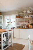 Christmas decorations in white, rustic kitchen