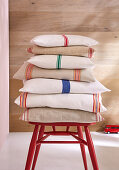 DIY linen cushions with colourful stripes made from tea towels