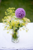 Bouquet of dill, chamomile and purple allium flowers