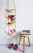Homemade hanging shelves made from woven baskets