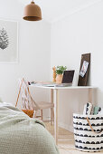Bright, Scandinavian-style bedroom with desk