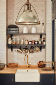 Storage jars on shelves on tiled wall above kitchen counter with integrated sink and wooden worksurface
