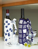 Bottles wrapped in patterned blue-and-white fabric