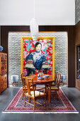 Stylish dining area with antique furniture and an Asian image
