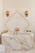 Luxurious bathroom with marble walls and bathtub
