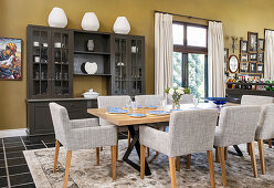 Upholstered chairs and dresser in dining area