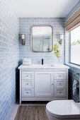 Bright bathroom with vanity and toilet