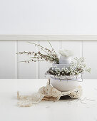 Delicate Easter arrangement with ranunculus and gypsophila