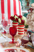 Festively set table decorated in red and white