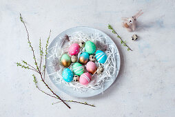 Colourful Easter eggs on a plate