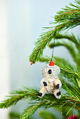 Bear with Christmas hat as a nostalgic Christmas tree pendant