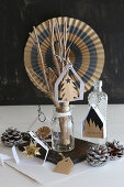 Handcrafted Christmas decorations: small paper houses for hanging up