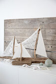 Sailing boat ornaments made from driftwood and fabric remnants