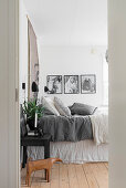 Bedroom in subdued shades with board floor