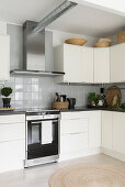 Cream cabinets and rustic accessories in modern kitchen