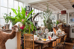 Set table decorated with bizarre curiosities in former factory sales area