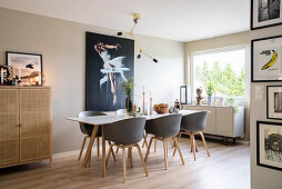 Grey shell chairs at table in beige dining room