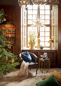 Seating area in front of festively decorated window