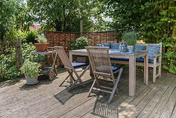 Wooden furniture on garden terrace