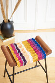 Stool with cover made from knitted tubes made using knitting dolly