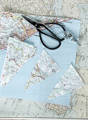 Triangles cut out from maps for paper bunting