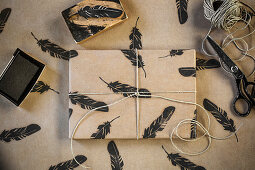 Wrapping paper with a decorative feather print
