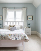 Pretty bedroom with pale blue walls