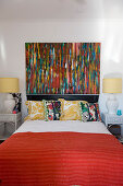 Colourful painting in colourful bedroom