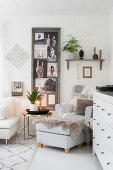 Ethnic-style collage of pictures in frame in cosy living room