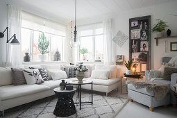 Collage of pictures in cosy, Scandinavian-style living room
