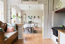 Open doorway from kitchen into dining room in Scandi-style interior