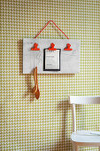 Handmade clipboard on kitchen wall