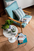 Pale blue fifties-style armchair and Tulip side table
