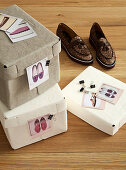 Shoeboxes labelled with clipped-on photos: organisation and storage idea